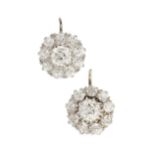 A pair of diamond cluster earrings, the central old cut stones each of approx 0.4ct within a
