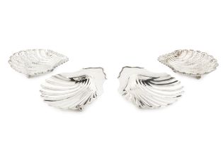 A pair of George III silver scallop shaped butter dishes, on ball feet by Charles Aldridge & Henry