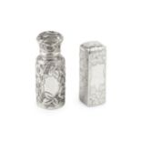 A late Victorian silver scent bottle, of cylindrical form with shaped hinged cover, embossed and