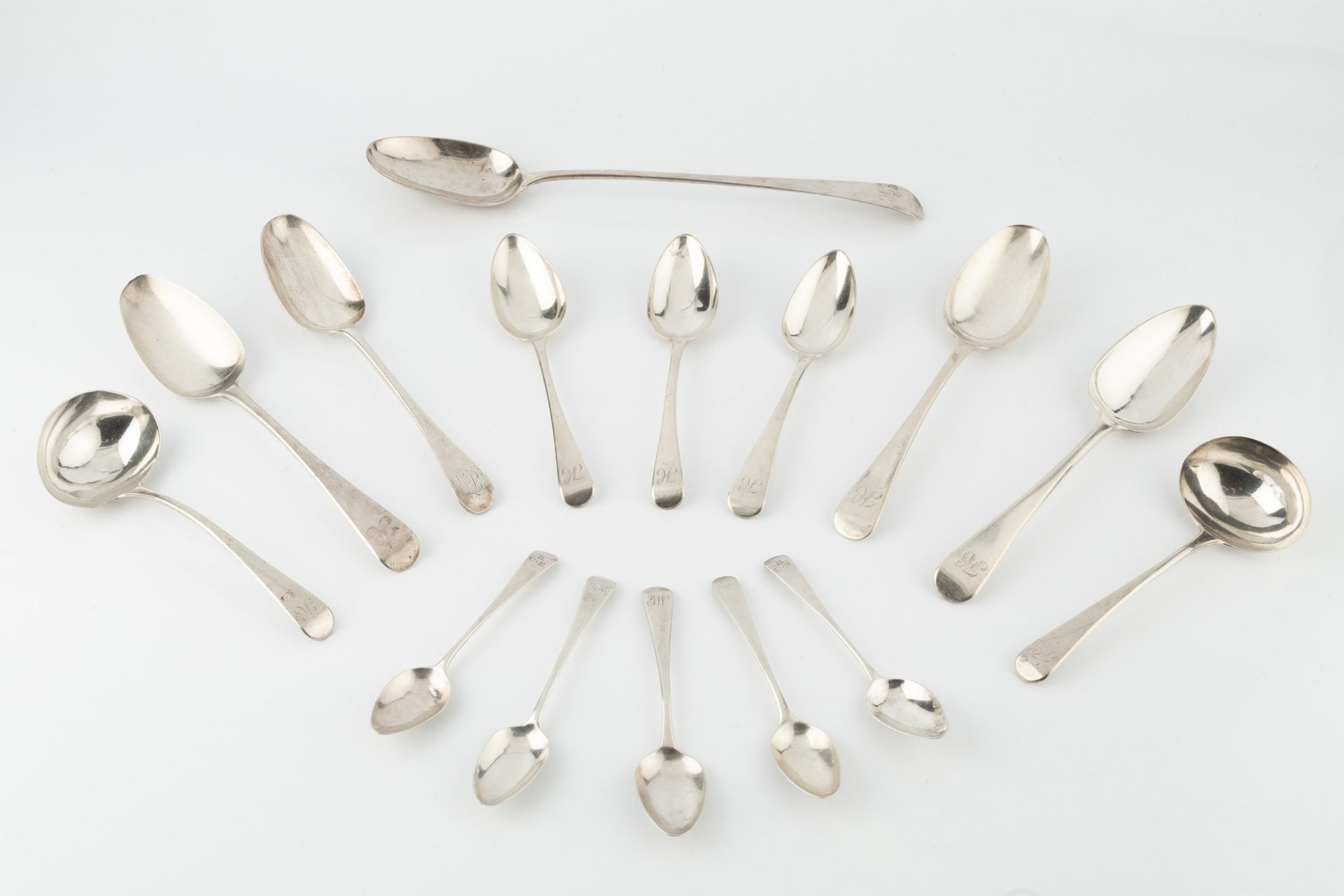 A matched service of Georgian and later silver old English pattern flatware, comprising a gravy