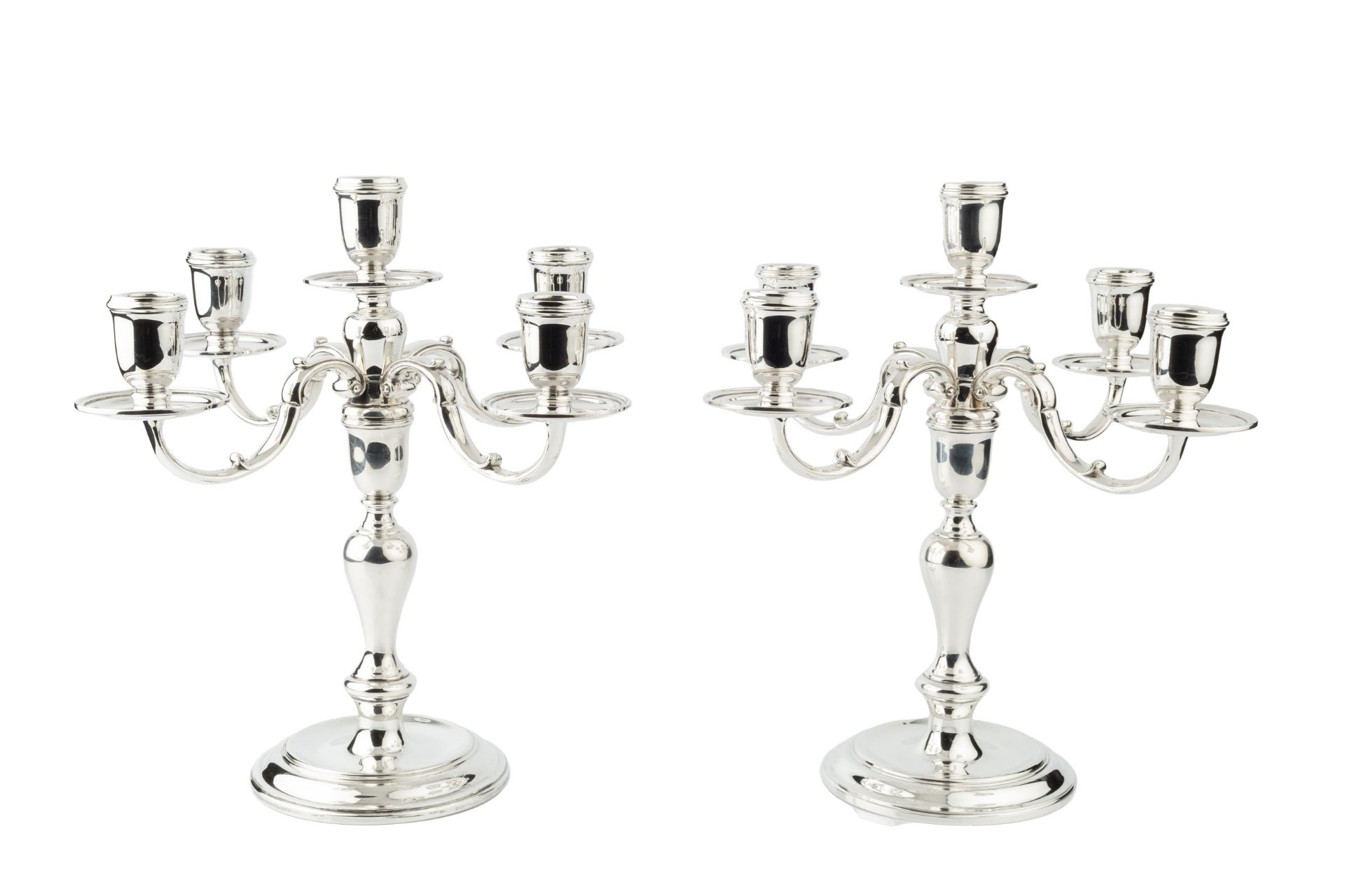 A pair of silver four branch five-light candelabra, the baluster columns having detachable pairs