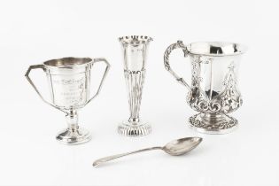 An early Victorian silver christening mug, the urn shaped body embossed and chased with shaped