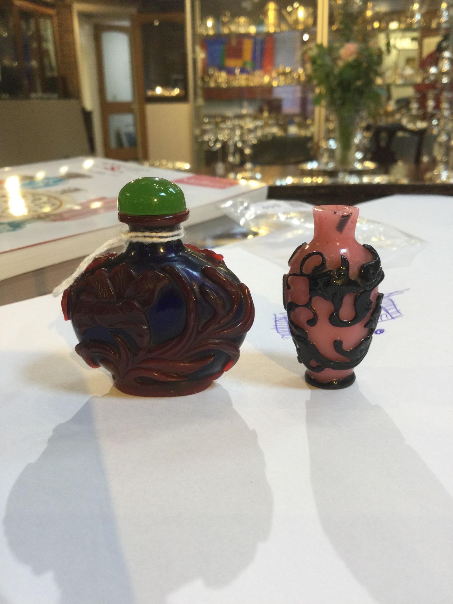 A Chinese red overlaid blue 'Peking' glass scent bottle, relief carved with flowering foliage and - Image 11 of 11
