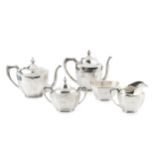 An American silver tea and coffee service, of faceted oval design, the teapot and coffee pot