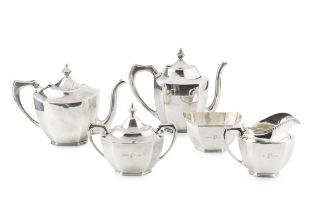 An American silver tea and coffee service, of faceted oval design, the teapot and coffee pot