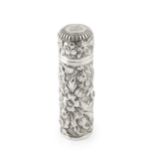 A late Victorian silver cylindrical scent bottle, embossed and engraved with stylised scrolling