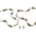 A grey and white uniform South Seas cultured pearl necklace, each pearl of approx 1.1cm diameter,