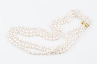 A triple strand uniform cultured pearl necklace, with 9ct gold bar clasp, 45.5cm long (pearls
