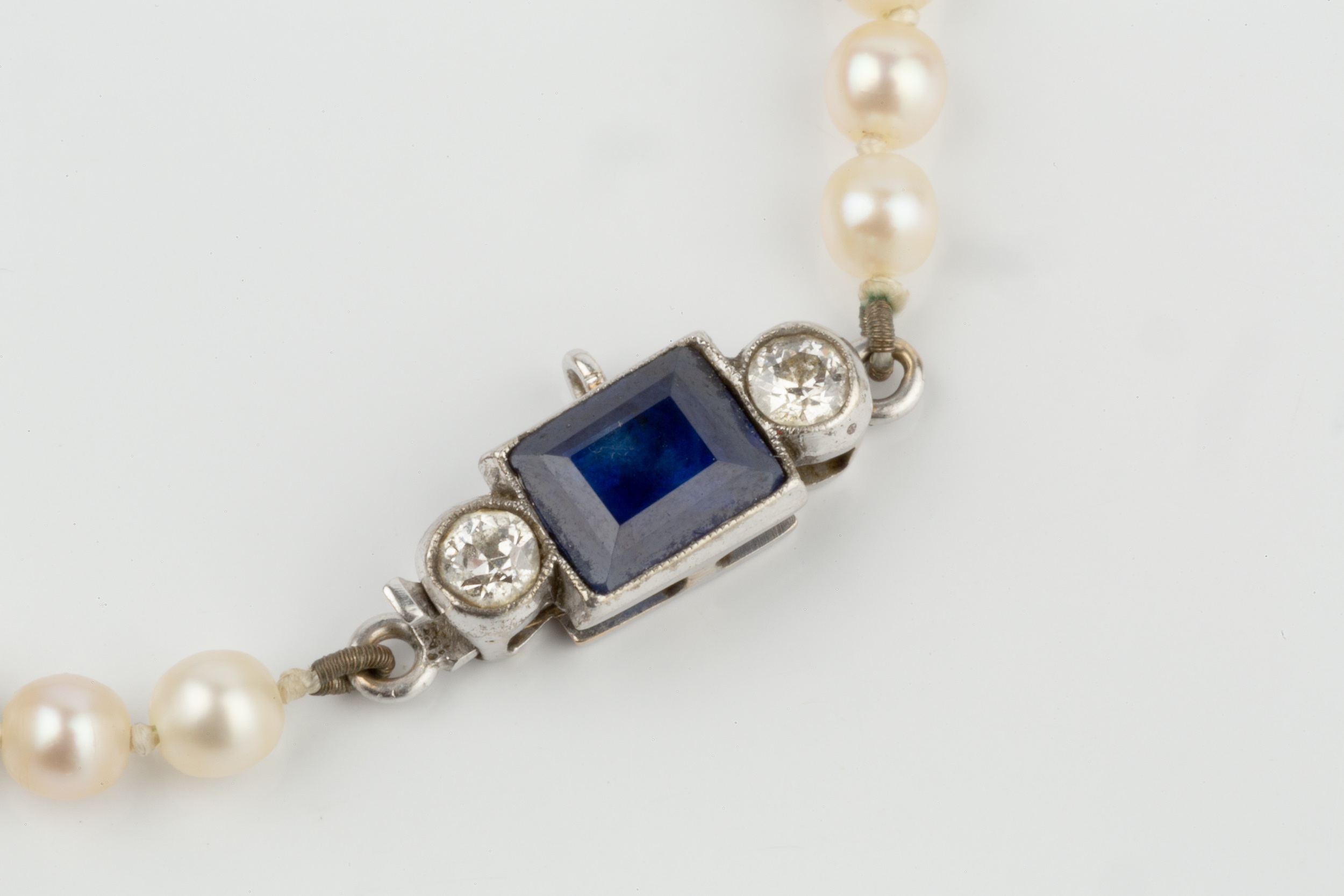 A single strand cultured pearl necklace, having sapphire and diamond set clasp centred with a - Image 2 of 6