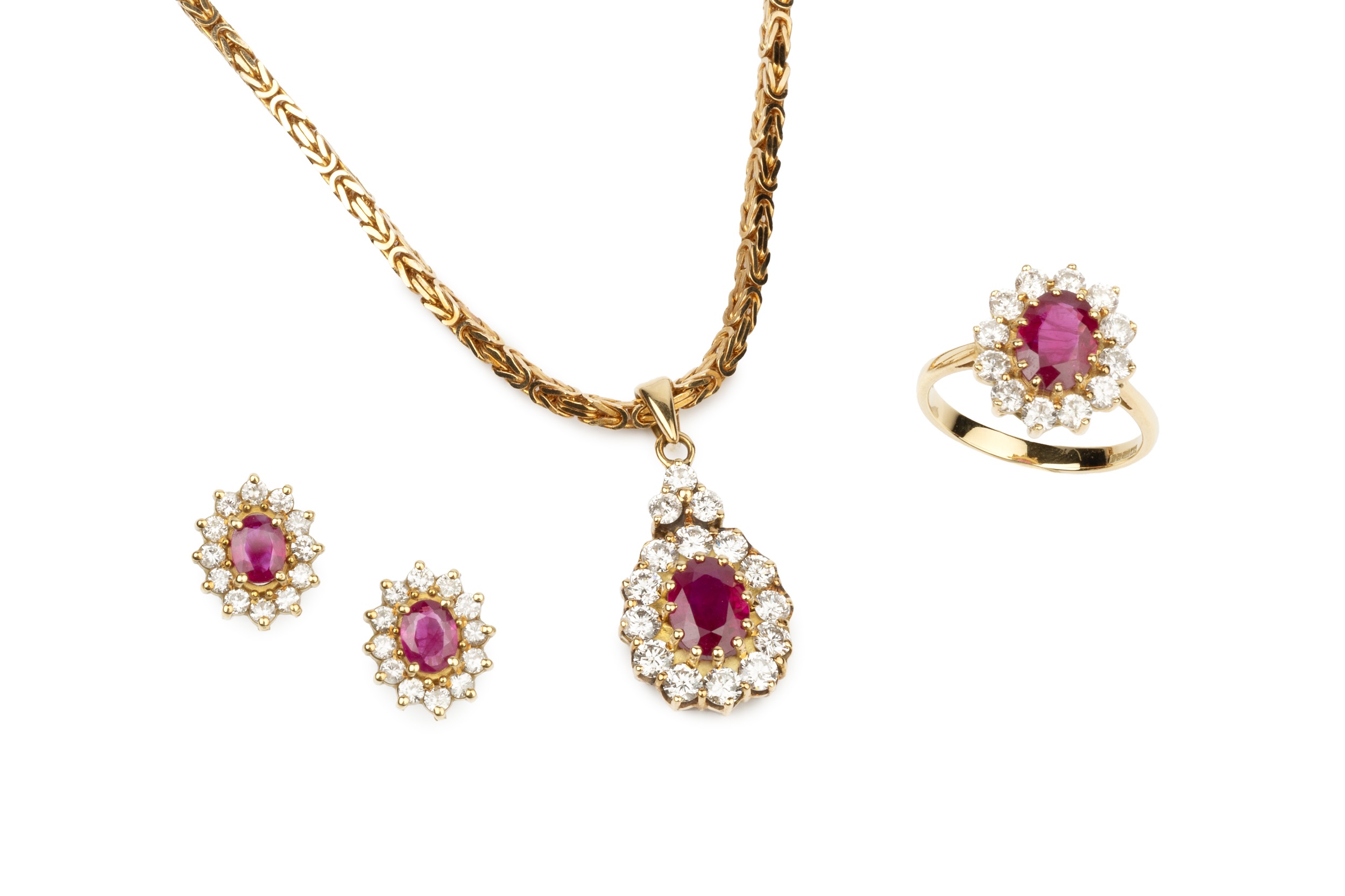 A suite of ruby and diamond jewellery, comprising a pendant of oval cluster form, the central oval
