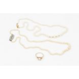 A single strand graduated cultured pearl necklace, the rectangular bowed clasp set with nineteen old