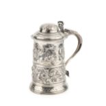 A George III silver tankard, with hinged domed lid, pierced thumbpiece and scroll handle with