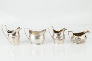 A George IV silver cream jug, engraved with a band of stiff leaves on a chequered ground by Thomas