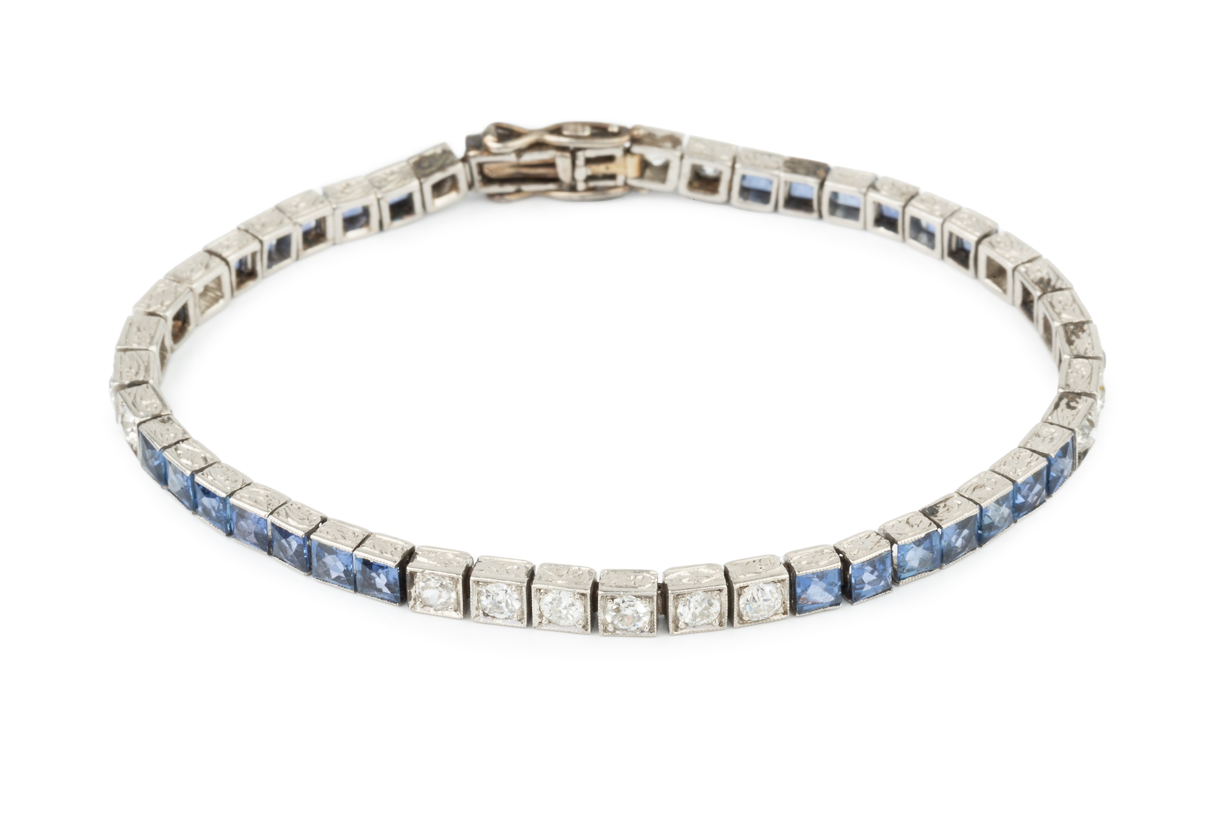 A diamond and sapphire line bracelet, having twenty two diamonds and twenty six sapphires in squared - Image 2 of 3