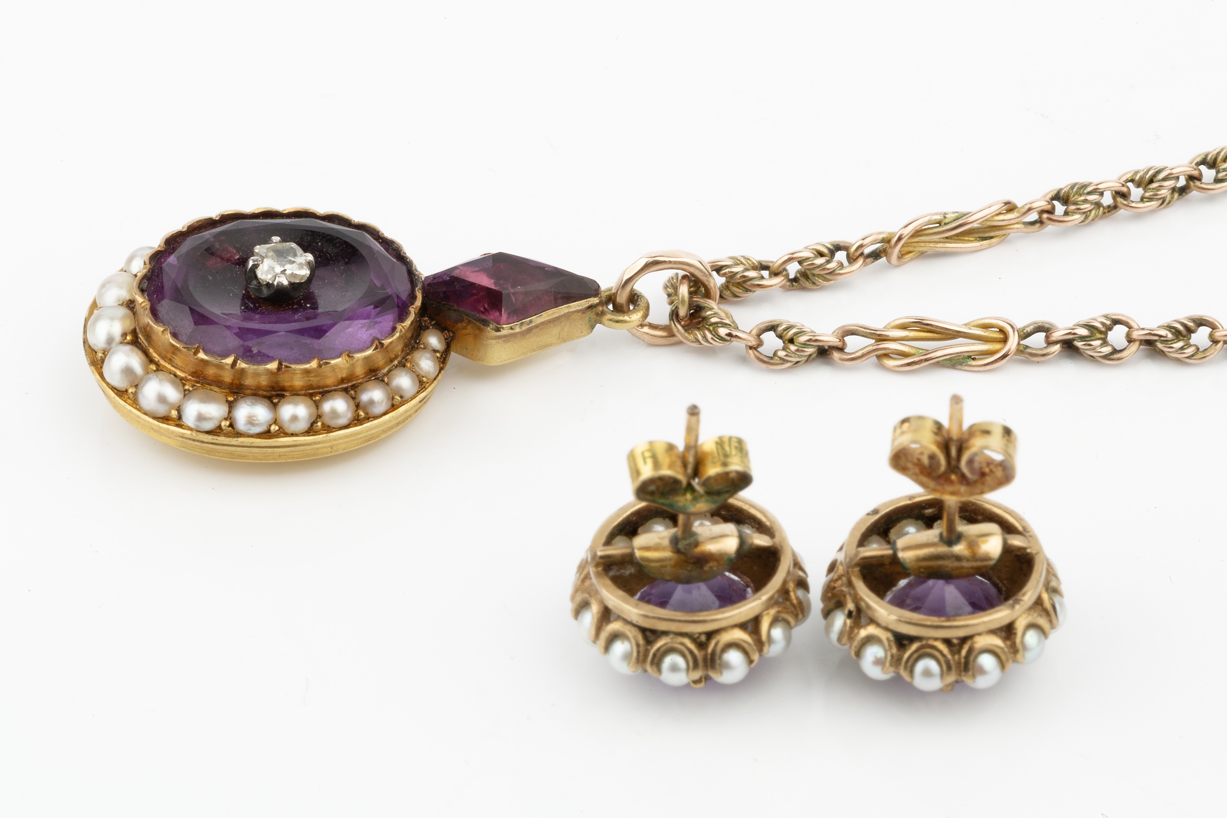 A Victorian amethyst, diamond and seed pearl pendant, the oval amethyst centred with a small - Image 2 of 3