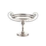 A George V silver twin handle tazza, with diaper-pierced border and scroll handles, on circular