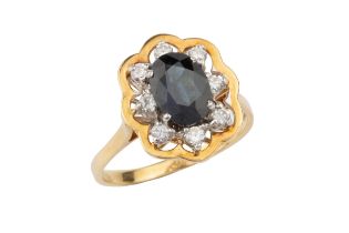 A sapphire and diamond dress ring, the oval central sapphire within a border of eight brilliant