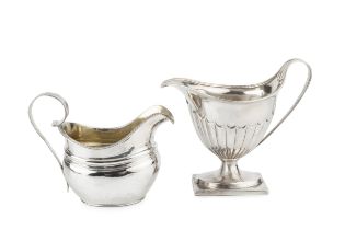 A George III silver cream jug, with shaped oval body, gadrooned border and reeded strap handle by