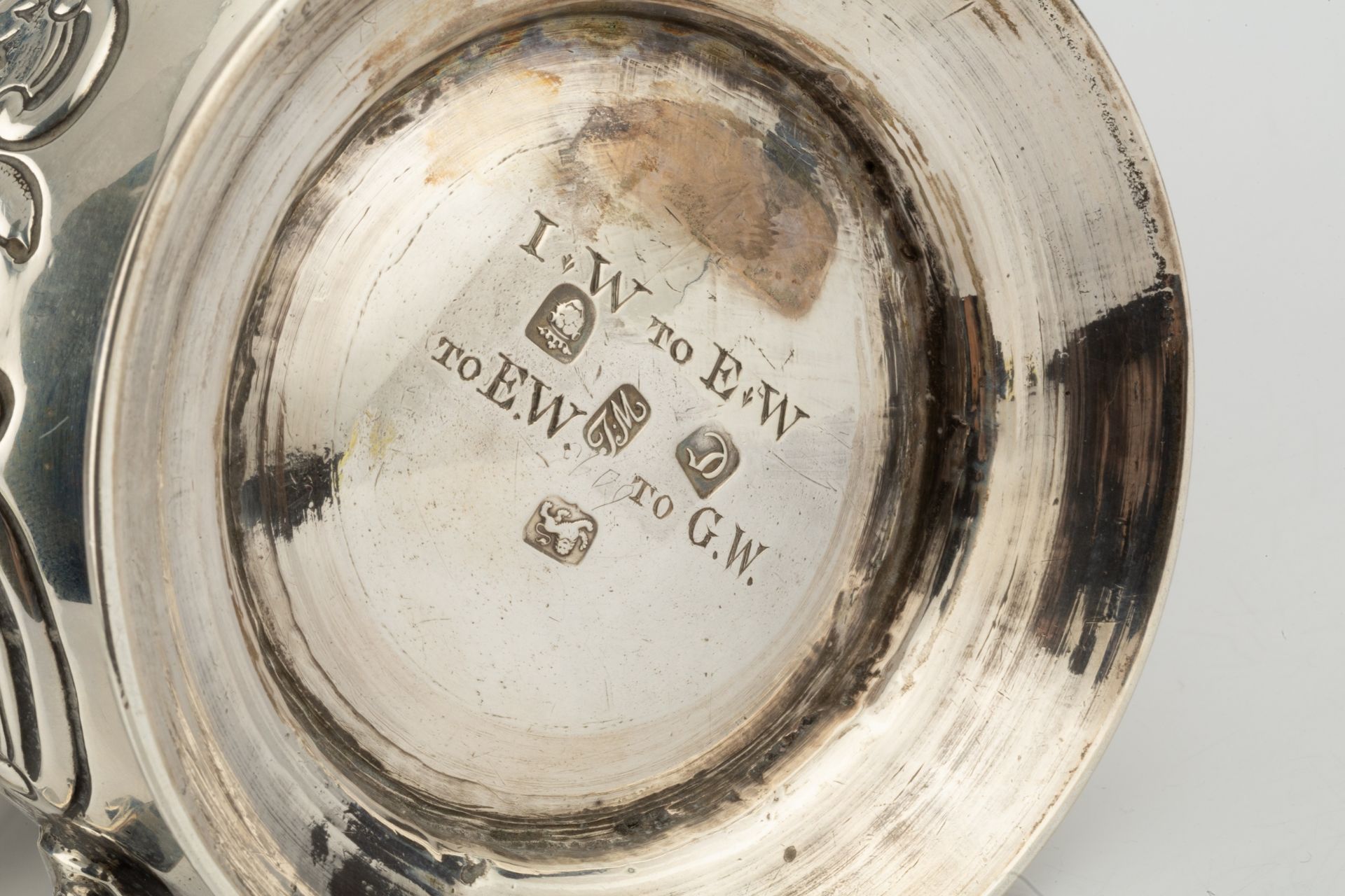 A George II silver pint mug, of baluster form, later embossed and engraved with flowering foliage - Image 3 of 3