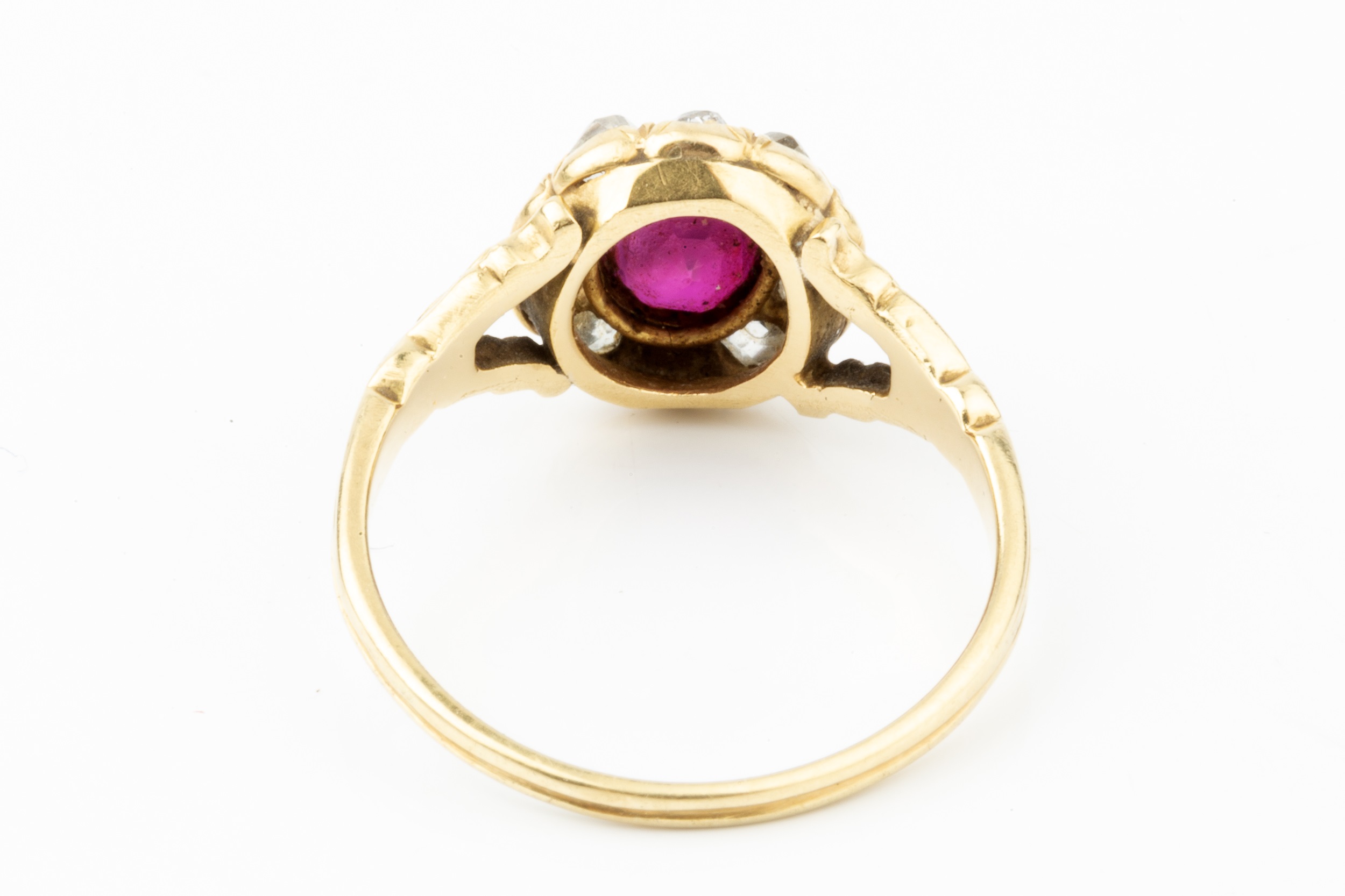 A ruby and diamond cluster ring, the oval cut ruby set within a border of ten old-cut diamonds, to - Image 2 of 4