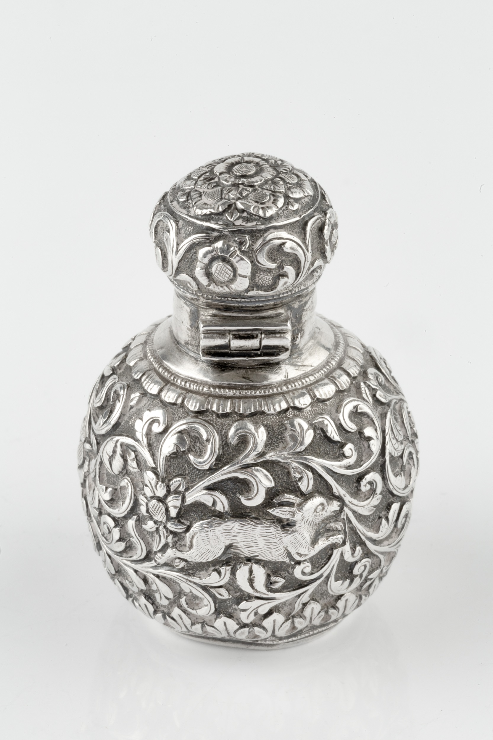 A late 19th century Anglo-Indian silver scent bottle, of globular form, embossed and engraved with a - Image 4 of 4