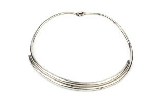 A Danish silver necklet by Georg Jensen, formed of two plain curved sections with loop hinge, no.