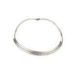 A Danish silver necklet by Georg Jensen, formed of two plain curved sections with loop hinge, no.