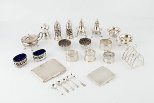 A collection of silver, comprising two cigarette cases with engine turned decoration, a five bar