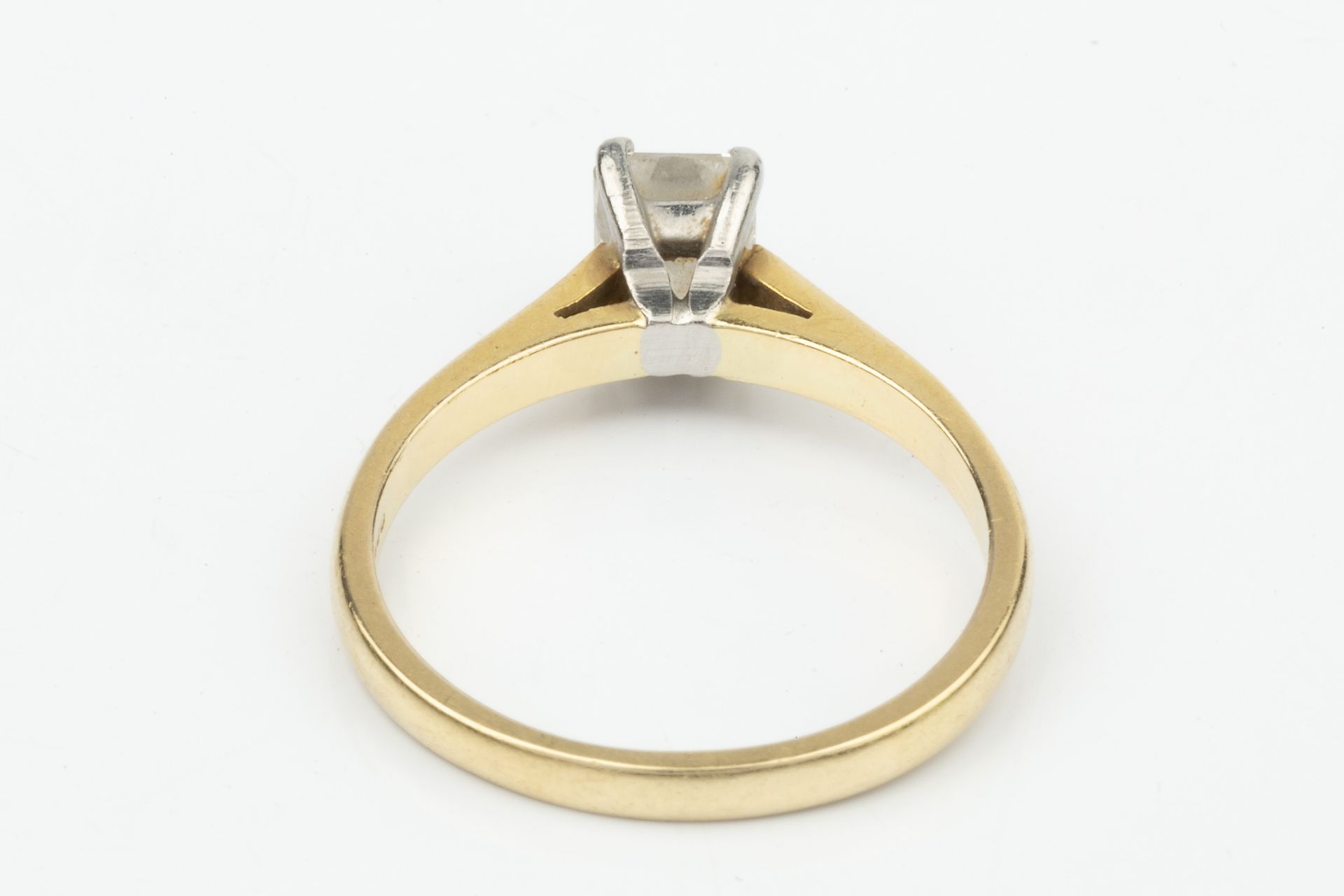 A diamond solitaire ring, the 'crisscut' emerald cut stone approx 0.7ct claw set in platinum to an - Image 4 of 5