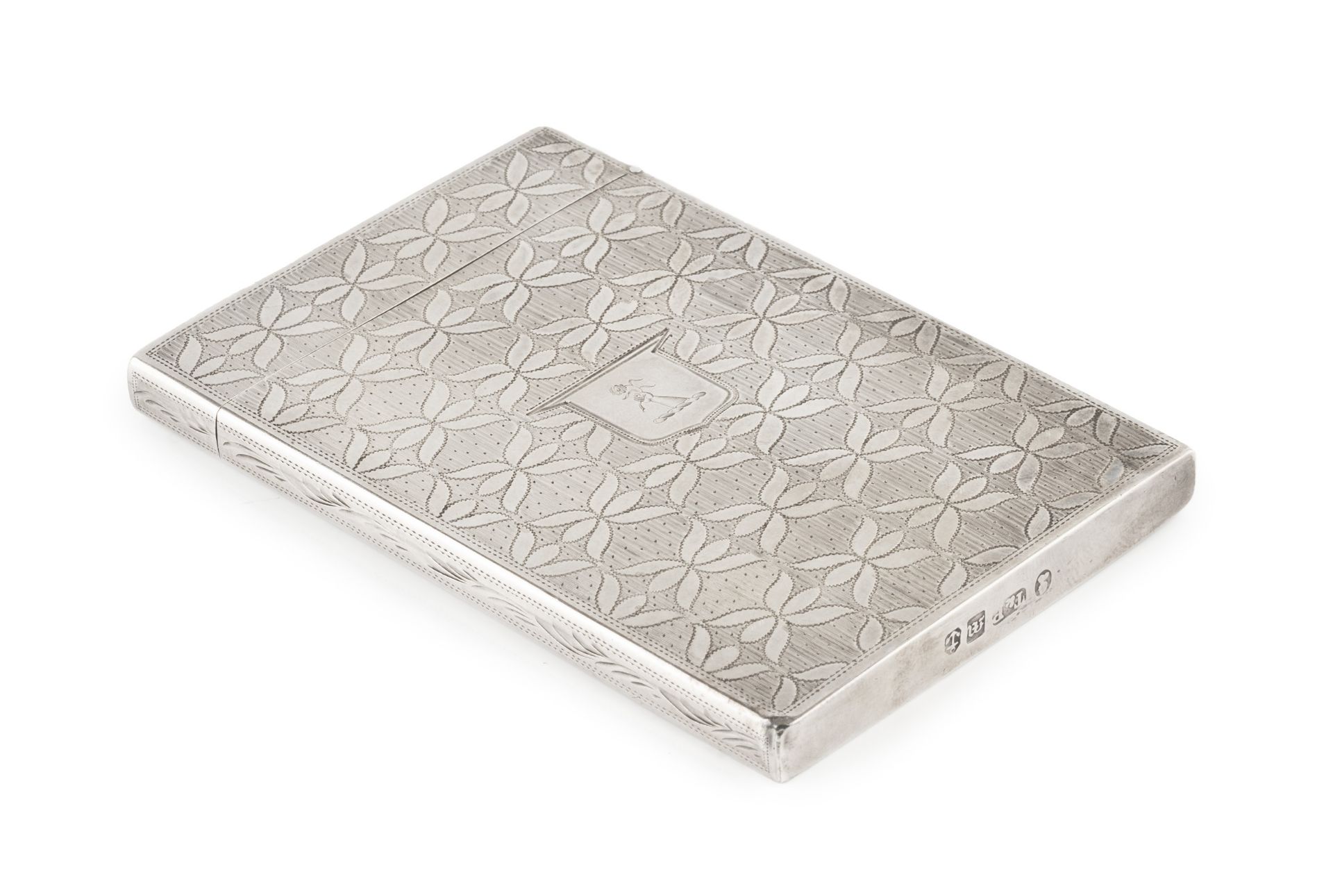 A William IV silver card case, of rectangular form, engraved to both sides with a pattern of