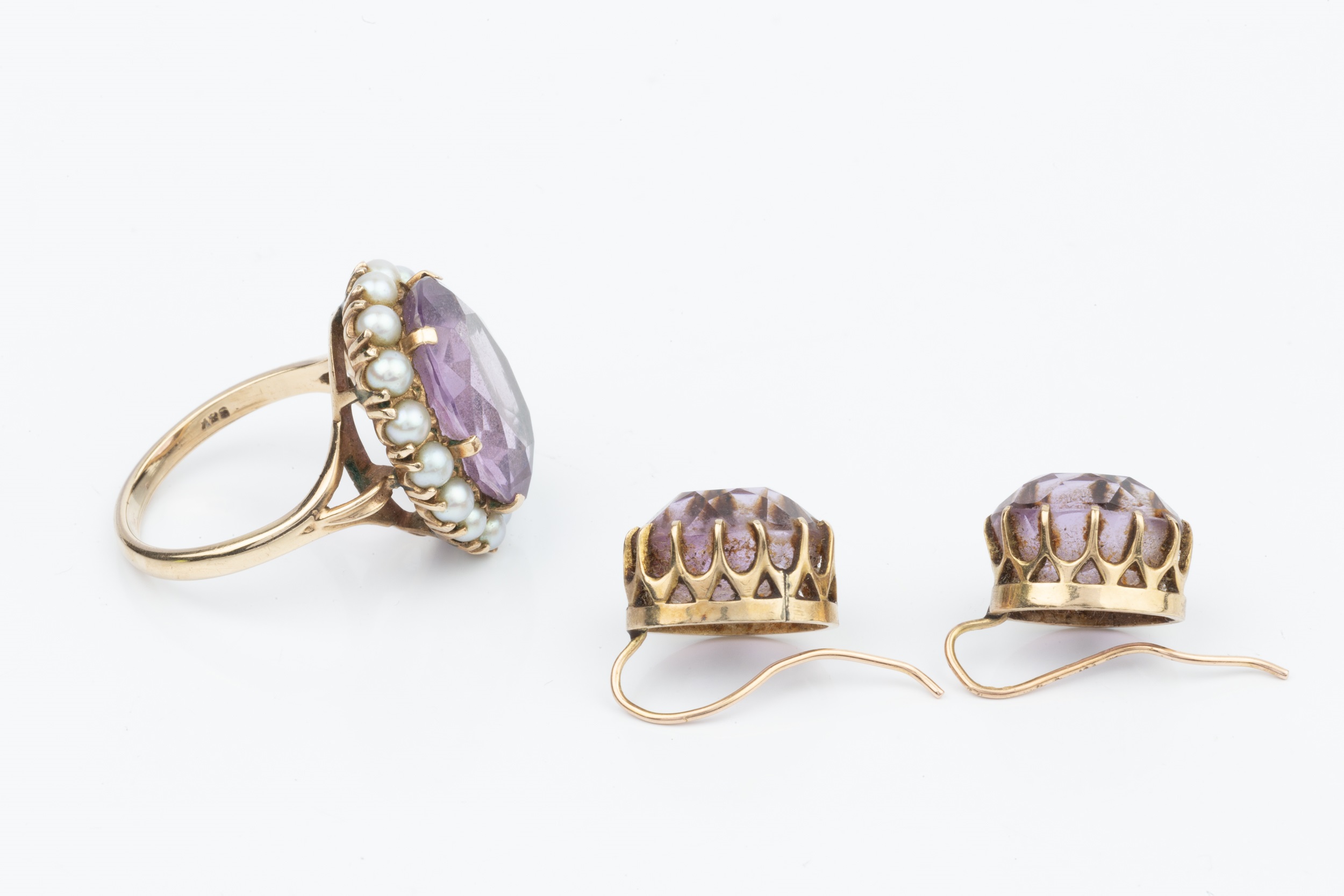 A 9ct gold, amethyst and pearl dress ring, the oval cut amethyst within a border of 16 small half - Image 3 of 3