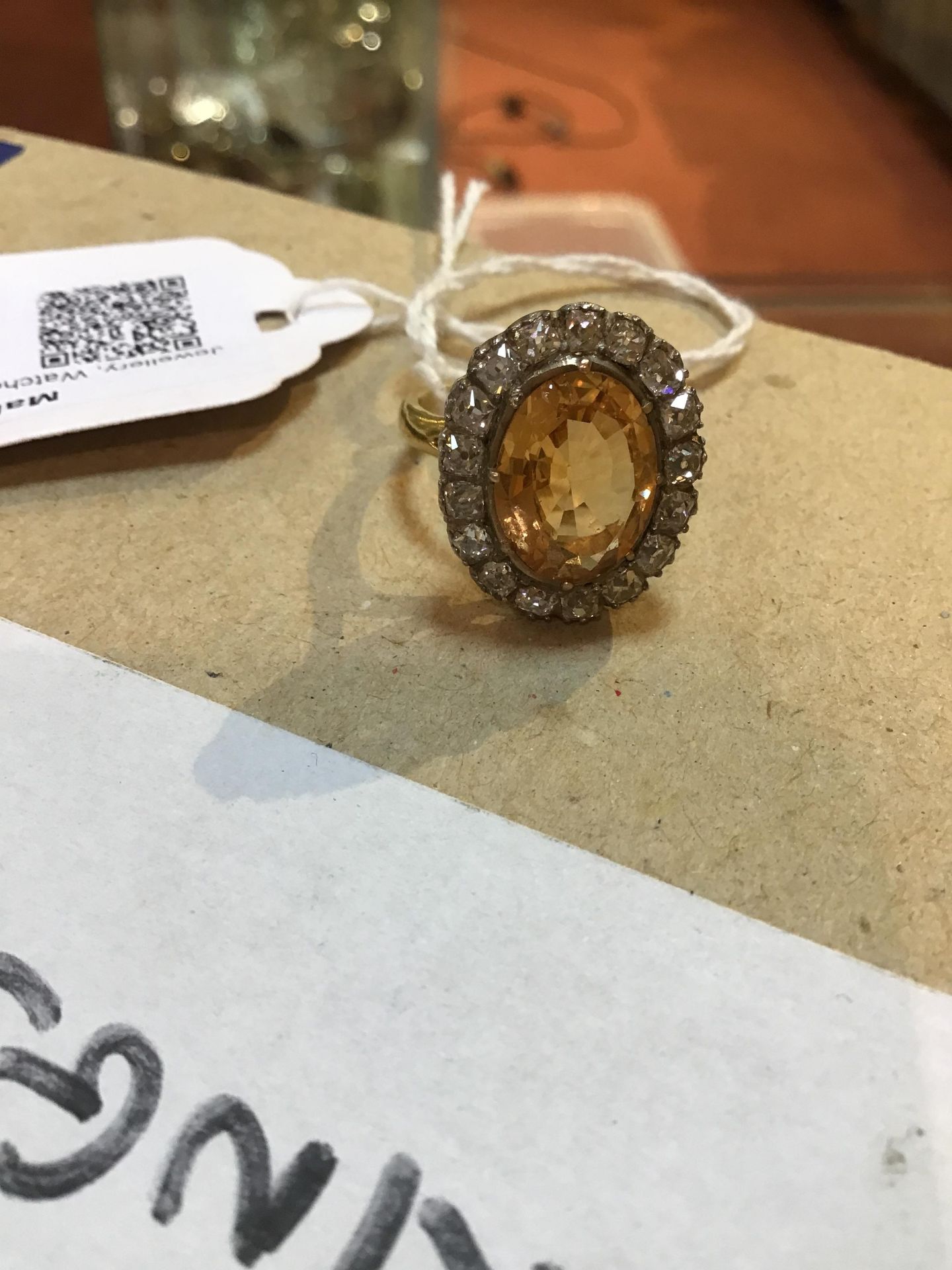 A topaz and diamond cluster ring, the oval central orange-brown topaz within a border of seventeen - Bild 8 aus 8