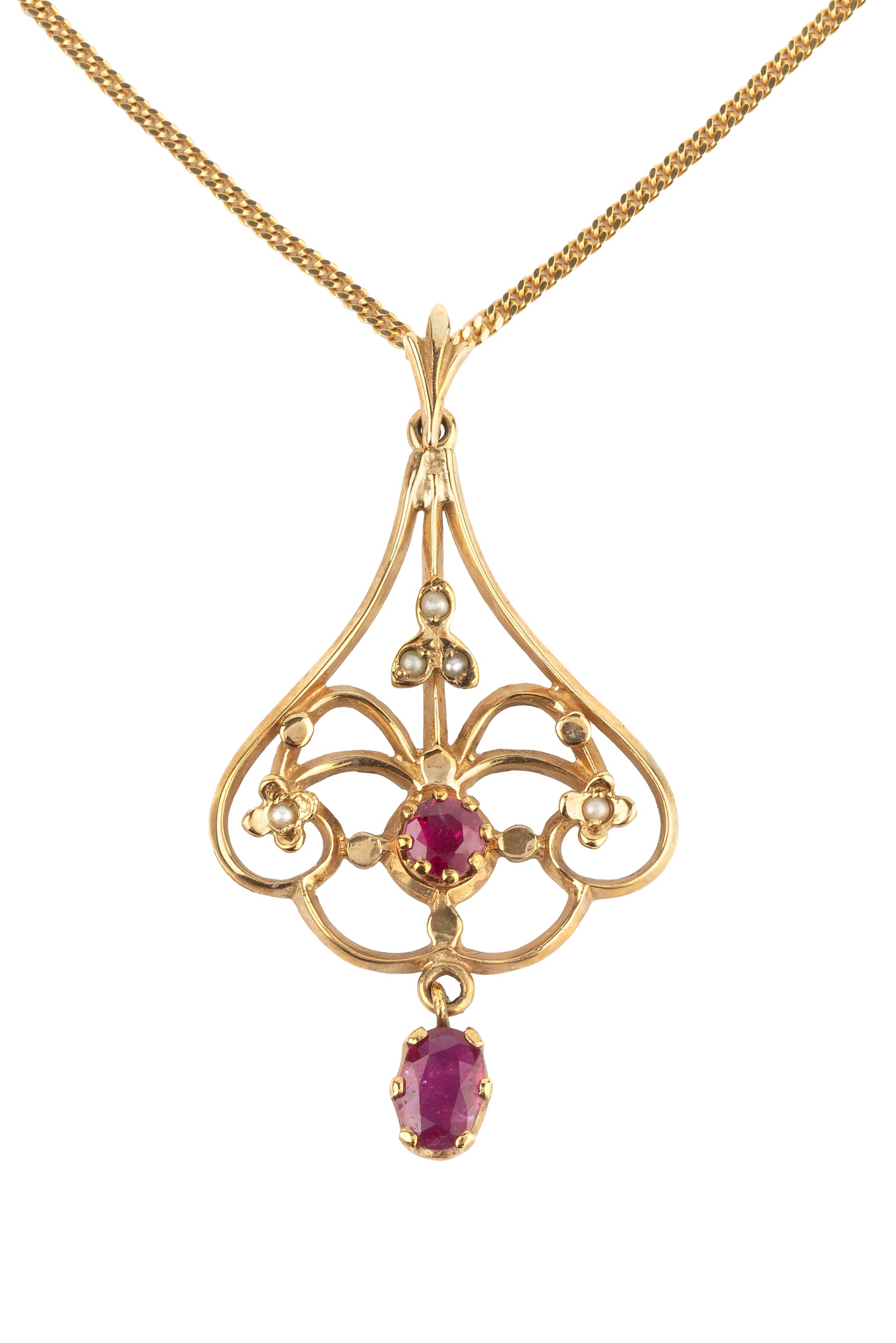 A 9ct gold, ruby and seed pearl pendant, of shaped openwork design, set with an oval cut ruby and