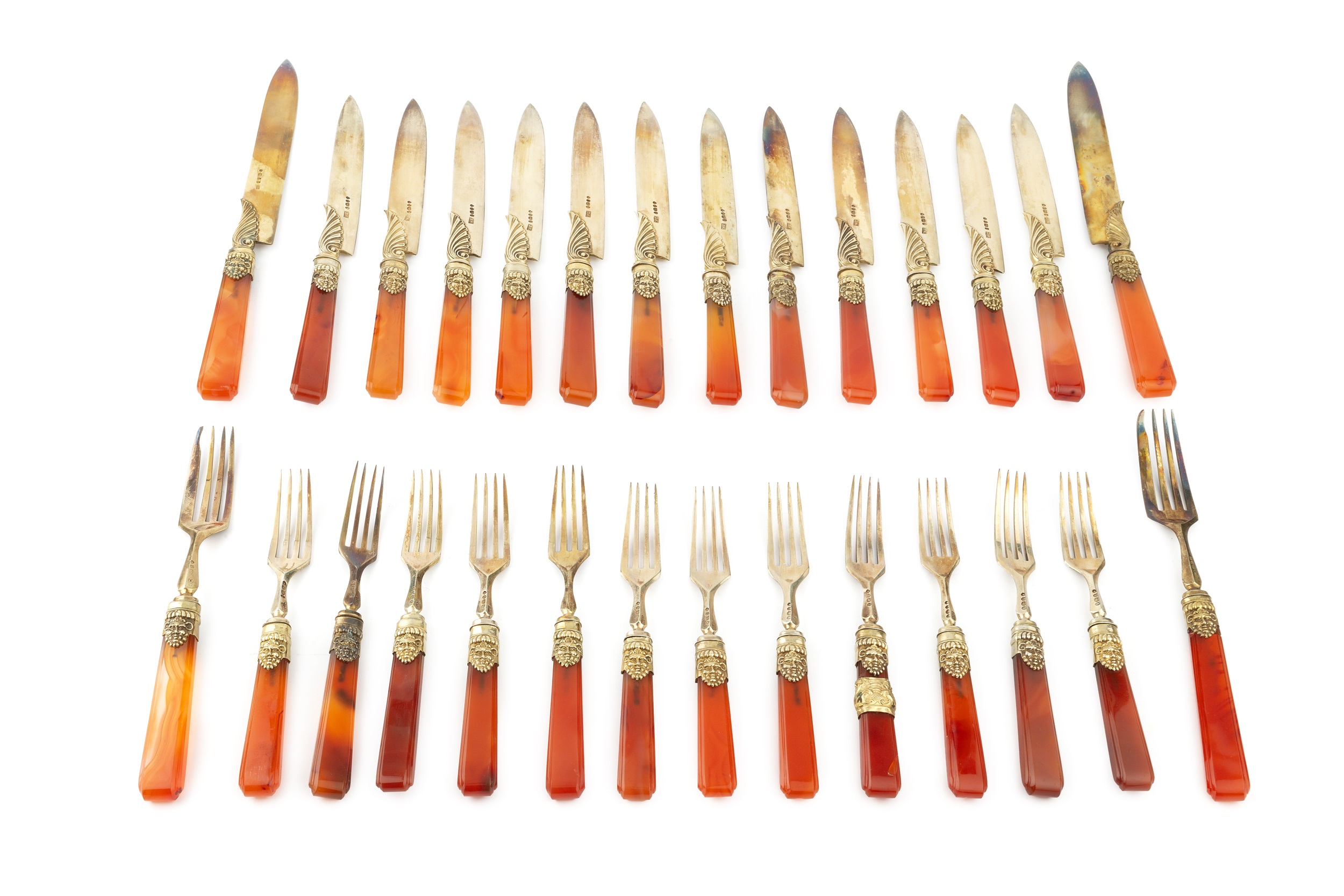 A set of twelve William IV silver-gilt and agate handled dessert knives and forks, with foliate