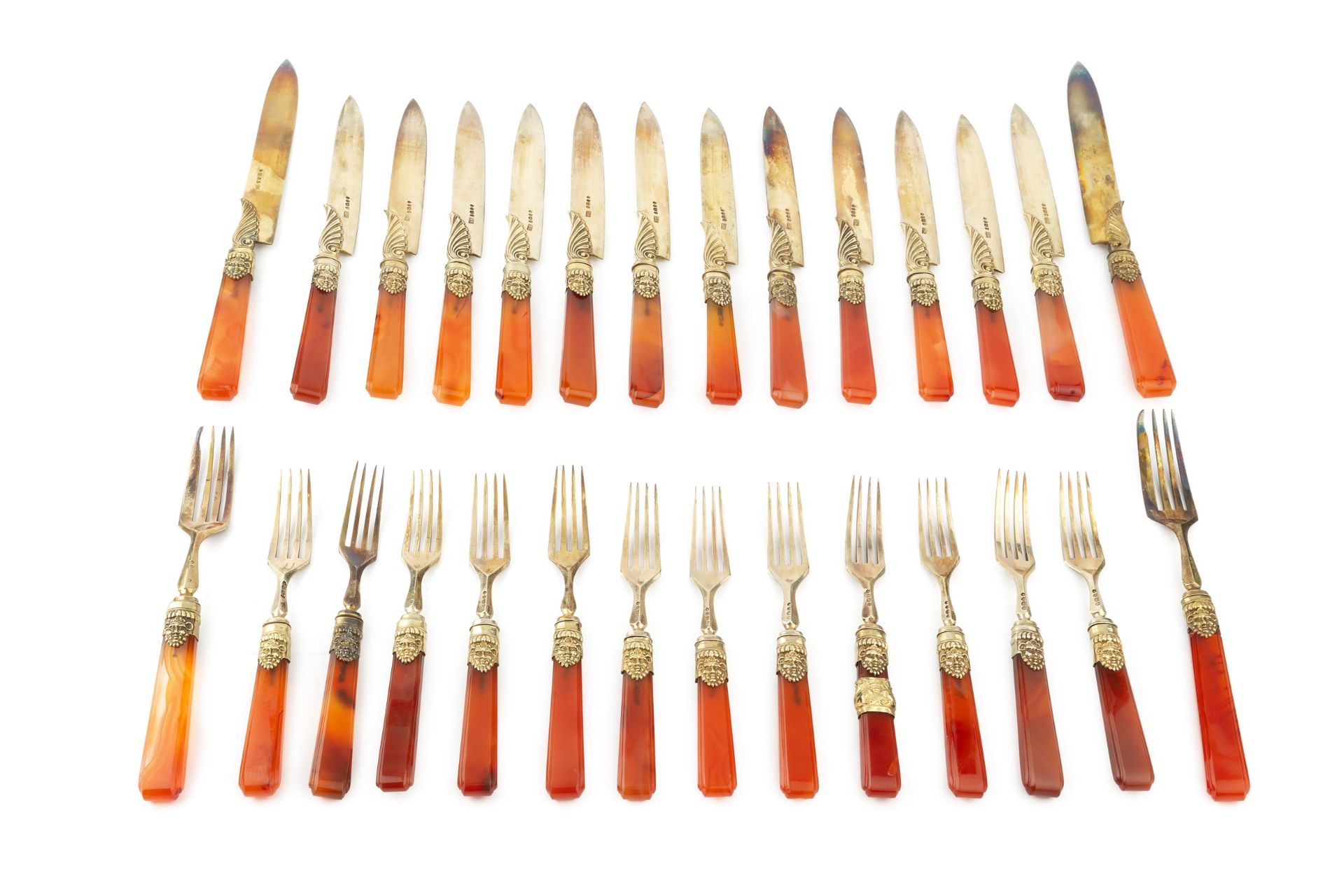 A set of twelve William IV silver-gilt and agate handled dessert knives and forks, with foliate