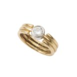 A diamond solitaire ring, the collet set stone of approx 0.4ct with 18ct yellow gold banded shank,