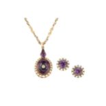 A Victorian amethyst, diamond and seed pearl pendant, the oval amethyst centred with a small