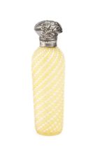 A late 19th century silver topped ridged glass scent bottle, with yellow and white spiral lattice