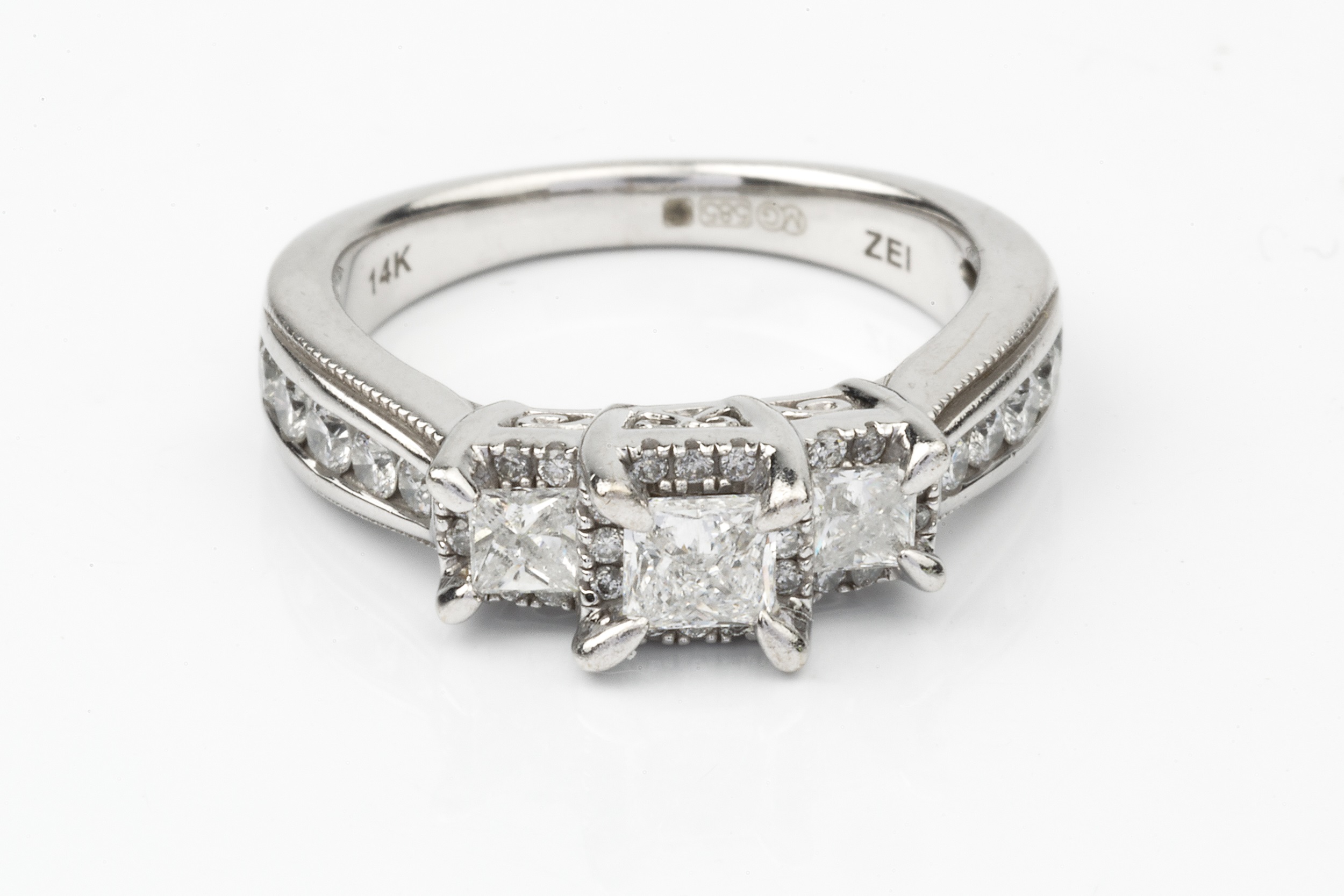 A diamond 'trilogy' ring, the three principal princess cut stones each within a border of small - Image 2 of 4