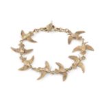 A 9ct gold bracelet, the links formed of a series of hummingbirds in flight, and having feather