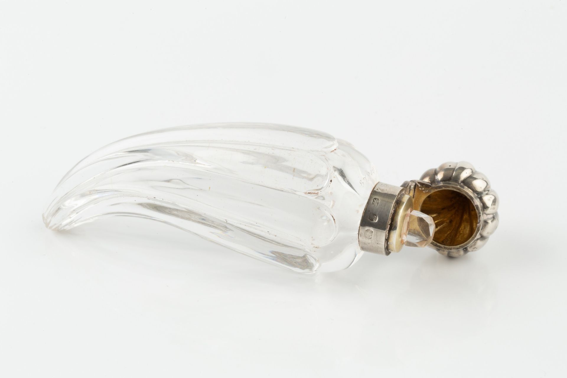 A late Victorian silver mounted glass scent bottle, of curved and lobed form, the hinged domed and - Image 3 of 4