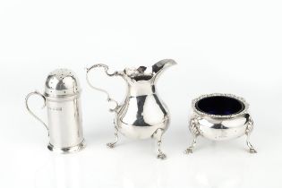 A George III silver cream jug, with scroll handle and three stepped feet, maker's mark worn,