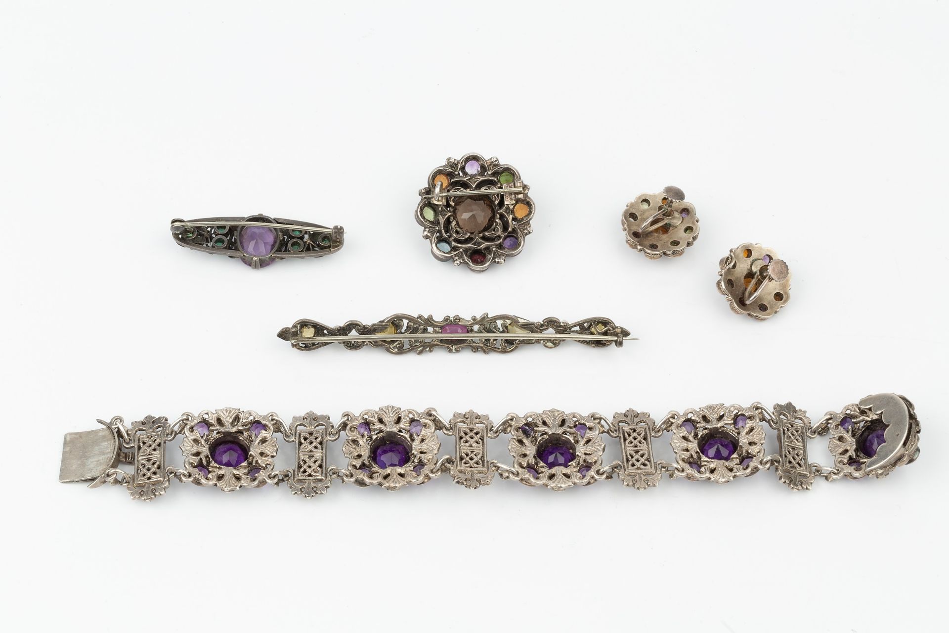 An Arts & Crafts design amethyst and pearl set bracelet, composed of circular white metal floral - Image 2 of 2