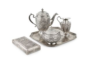 An Indo-Persian silver three piece tea service on tray, comprising teapot, sucrier and cover, and