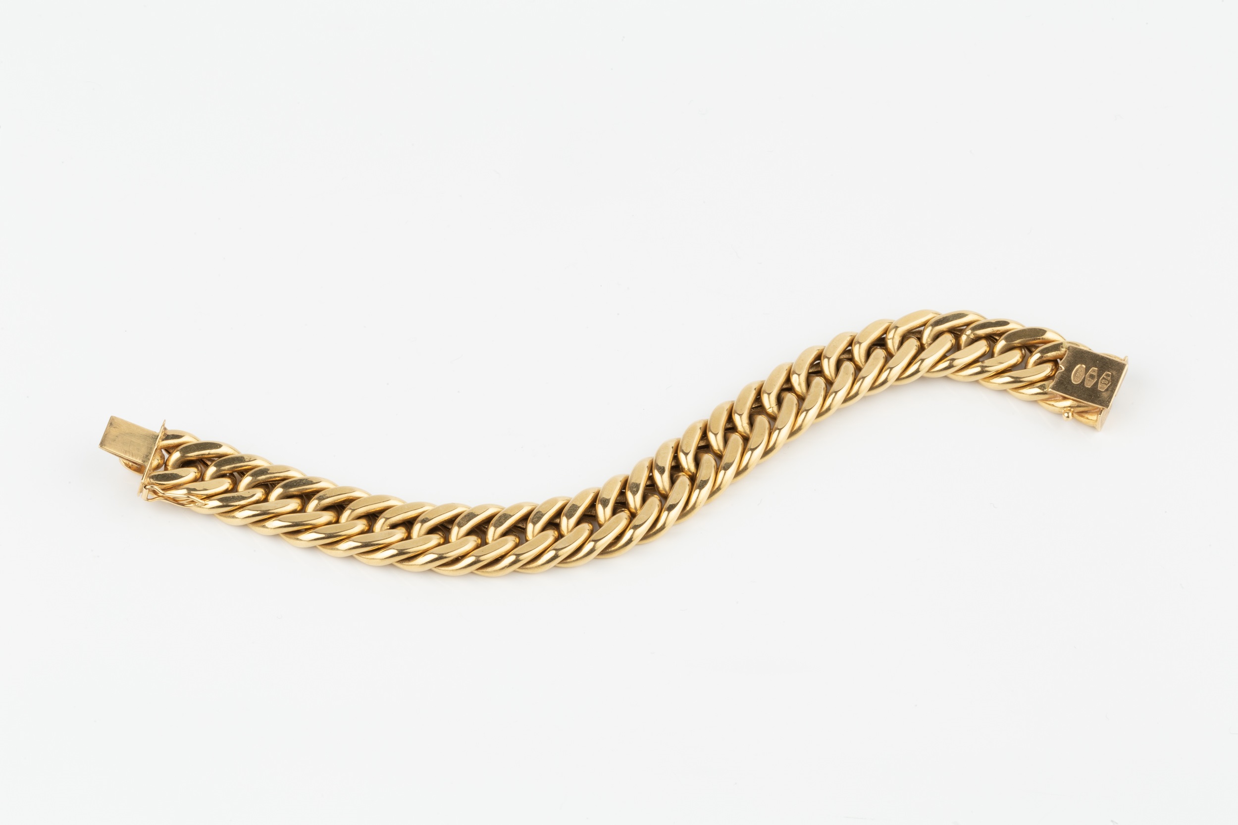 An 18ct gold hollow curb link bracelet, the clasp stamped 750, 18.5cm long Approx weight 30.1g - Image 2 of 2