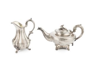 An early Victorian silver teapot, with reeded compressed body, foliate capped spout and floral