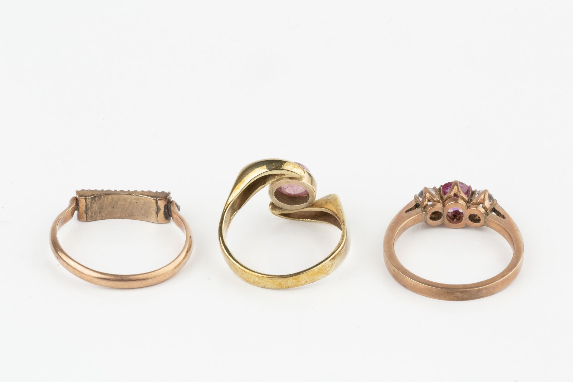 A 9ct gold dress ring, set with a single pink cabochon stone, the shank stamped 375, a pink and - Image 3 of 3
