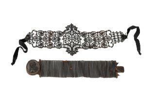 A Berlin ironwork bracelet, composed of a series of openwork panels decorated with foliate motifs,