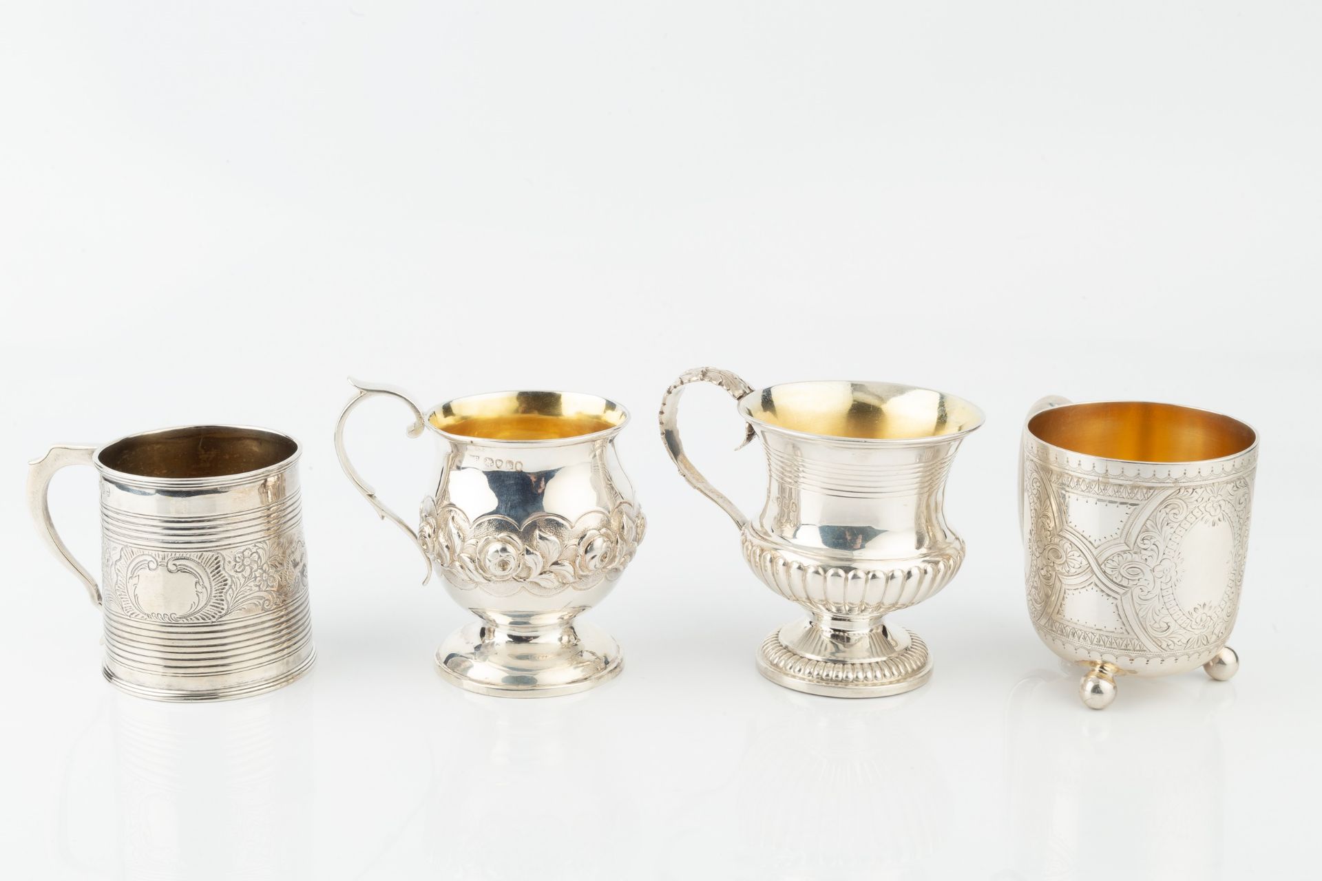 A George IV silver christening cup, of reeded and part lobed urn form, with foliate cast scroll - Image 2 of 2