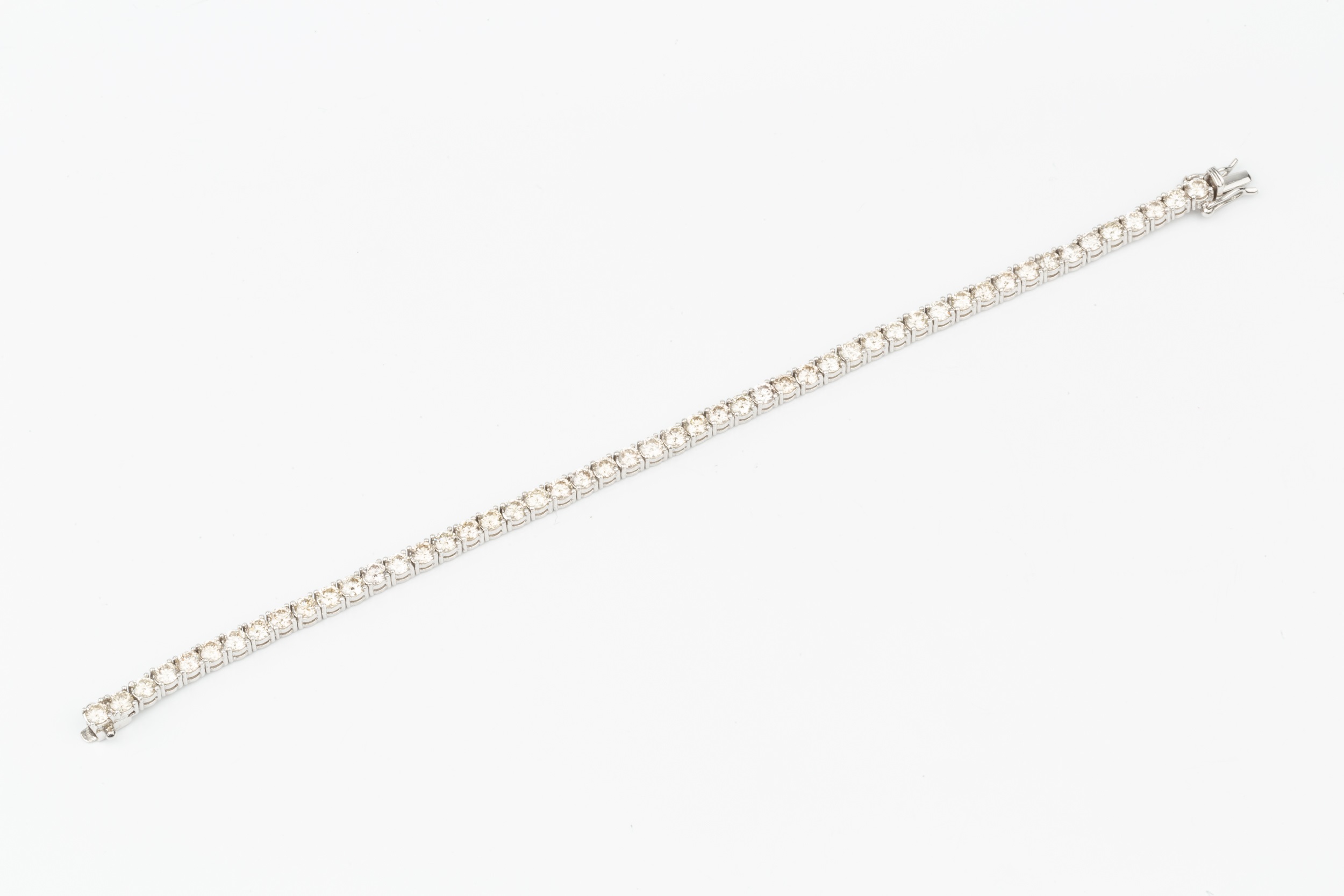 A diamond line bracelet, set in platinum with fifty round brilliant cut stones, with WGI report - Image 3 of 3